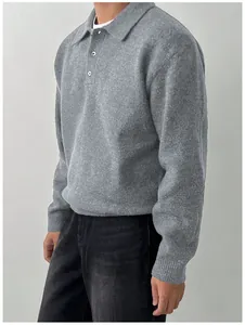 Close-up of men's grey polo collar knit sweater with soft texture and relaxed fit