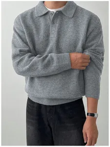 Detailed view of a grey men's polo collar knit sweater showing the thick wool texture