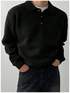 Detail of men's black polo collar knit sweater with soft texture and buttons