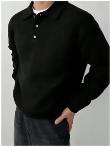 Close-up of men's black knit polo sweater featuring a classic buttoned collar detail