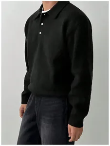 Detailed side profile of a men's black polo collar knit sweater with button lapel.