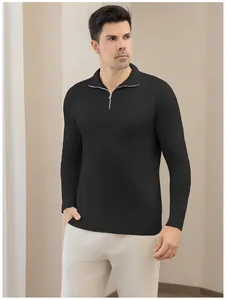 Detailed view of a premium men's black quarter-zip knit polo sweater for a refined casual look