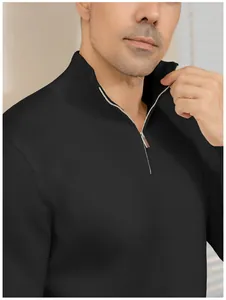Detail view of a black men's slim-fit quarter-zip knit sweater with ribbed collar.