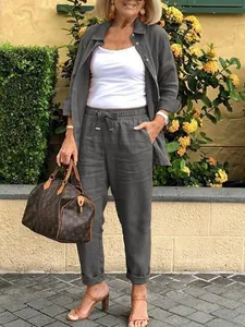 Casual dark grey two-piece linen set featuring a button-up shirt and elastic waist pants