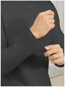 Detail view of men's slim fit black knit polo sweater showing ribbed cuff texture.