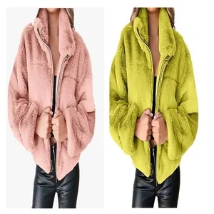 Detailed view of women's plush faux fur zip-up jackets in pink and lime green colors