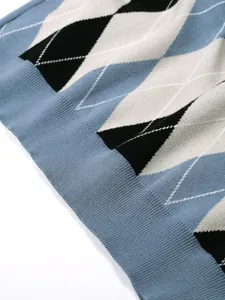 Close-up of men's argyle knitted pullover sweater showing blue and black diamond pattern