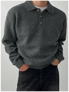 Detailed view of men's grey long-sleeve knit polo sweater featuring soft texture and three buttons