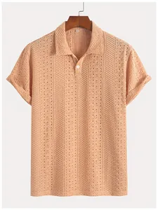 Close-up of the textured vertical stripe knit pattern on a men's apricot short sleeve polo shirt.
