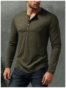 Detailed macro shot of an olive green Henley long-sleeve shirt showing premium slub texture.