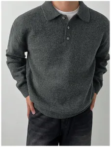 Close-up of men's charcoal grey polo neck knit sweater with soft texture