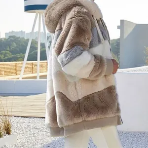 Detailed side view of an oversized warm patchwork plush hooded jacket for women in winter