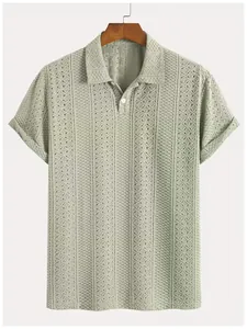Detailed view of the intricate hollow-out vertical stripe texture on a green knit polo shirt
