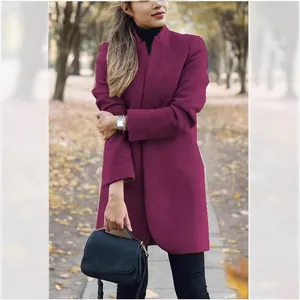 Elegant burgundy stand-up collar woolen coat for women, styled in autumn park setting.