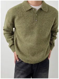 Detail view of men's green knit sweater with soft polo collar and button placket