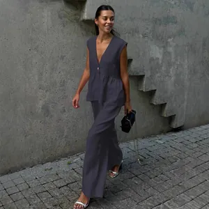 Elegant dark grey sleeveless V-neck top and wide-leg pants set in street style view