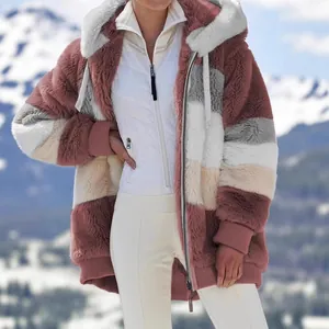 Cozy color-block plush hooded jacket for women in winter snow mountain landscape