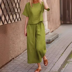 Casual women's green linen two-piece set with loose top and wide-leg trousers
