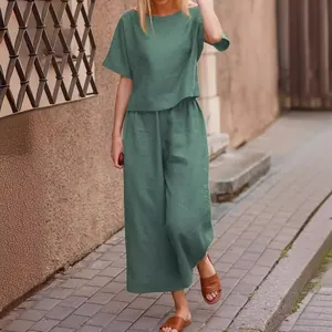 Casual two-piece green cotton linen set with short sleeve top and wide leg pants