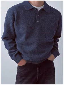 Close-up detail of a men's navy blue polo collar knit sweater with button placket