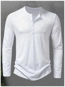 Detail of men's white long-sleeve Henley shirt with four-button placket and slub cotton fabric