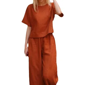 Casual two-piece linen set with short sleeve top and wide leg pants in rust orange color