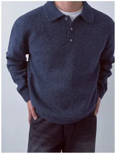 Detailed view of a navy blue men's knit Polo sweater with a soft texture and buttons