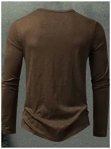 Back view of brown slub cotton long sleeve t-shirt with detailed fabric texture.