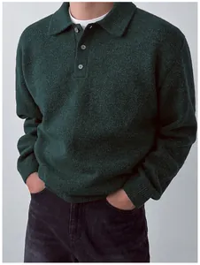 Macro view of a dark green men's Polo collar knit sweater with elegant button detailing