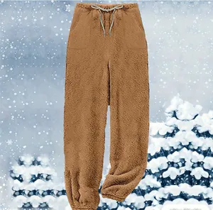 Detailed view of warm brown plush loungewear pants with soft fleece texture and drawstring
