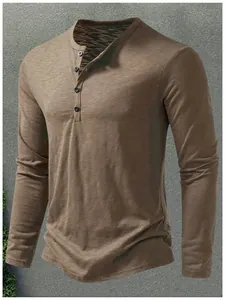 Detail view of men's khaki Henley long sleeve shirt with button neckline
