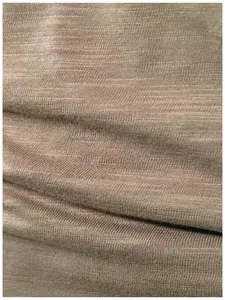 Macro detail showing breathable slub texture of high-quality fabric for men's T-shirt