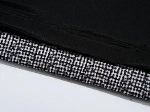 Close-up detail of high-quality fabric and neat stitching on men's casual blazer jacket.