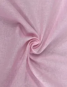 Close-up macro view of light pink cotton linen fabric showing breathable weave texture