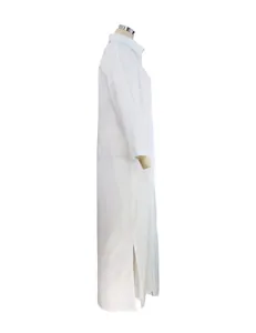 Side view detail of a white cotton linen long sleeve maxi shirt dress with side slits.