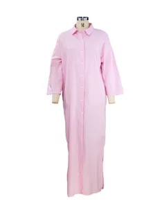 Front view detail of a pink long-sleeved cotton linen button-down maxi shirt dress.