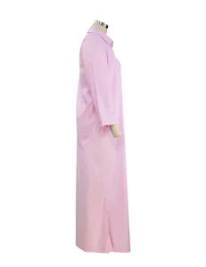 Side profile view of a pink long-sleeved cotton linen maxi shirt dress for women.