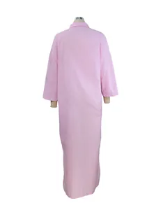 Full back view of a pink long-sleeved cotton linen maxi dress displayed on a mannequin