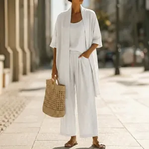 Elegant white summer 3-piece linen set with long cardigan and wide-leg trousers
