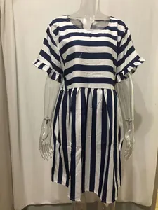Detail view of blue and white striped patchwork dress with ruffled short sleeves