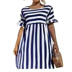 Detail of a casual navy blue striped dress with ruffle sleeves and patchwork design