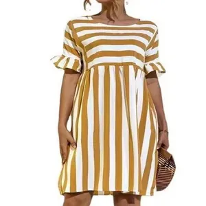 Detail view of yellow striped dress with ruffle sleeves and patchwork pattern