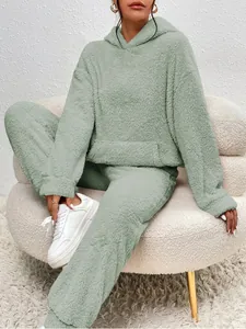 Cozy sage green fuzzy fleece lounge set featuring hoodie with pocket and matching pants