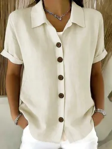 Close-up of casual women's short sleeve linen-cotton shirt with brown buttons detail