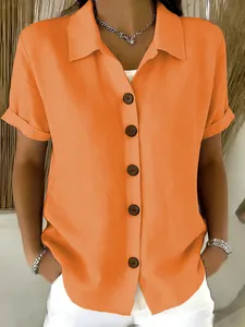 Close-up detail of women's orange cotton linen casual short sleeve button-down shirt