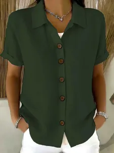 Close-up view of a women's olive green cotton linen short sleeve button-up shirt