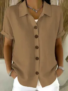 Detail of a casual khaki short-sleeve cotton linen shirt with wooden buttons