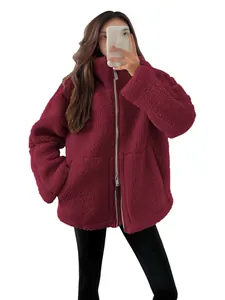 Oversized burgundy sherpa jacket with high collar and front zipper closure for winter