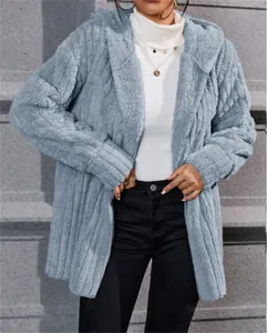 Close-up detail of light blue winter polar fleece hooded jacket with vertical stripes.