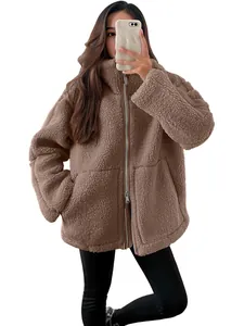 Cozy brown sherpa jacket with oversized fit and high collar featuring a double zipper